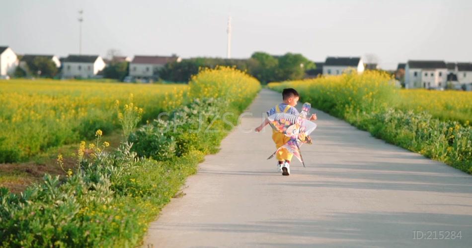 油菜花儿童男孩奔跑的背影升格慢镜头视频